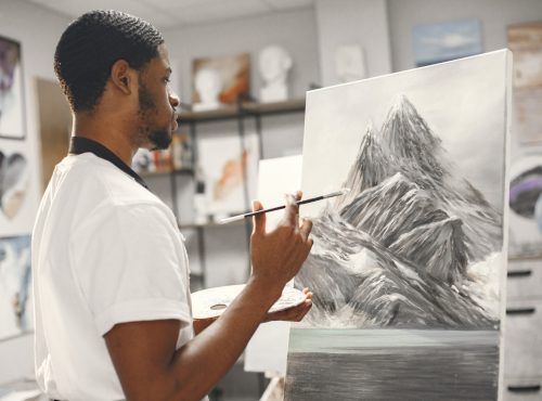 artist drawing happily after overcoming creative block